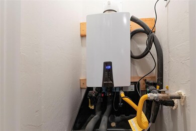 Detailed view of a textured wall and tankless water heater