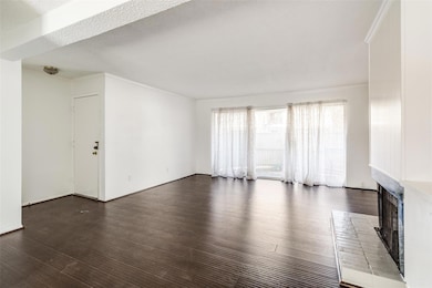 Unfurnished living room with a textured ceiling, c