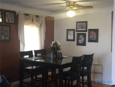 Beautiful dining room with hardwood floors and lot