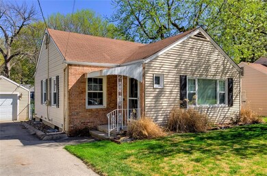 Home exterior is metal siding with brick accent.  