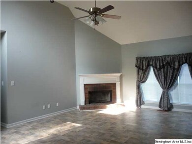 Livingroom with wood burning FP  Laminate hardwood