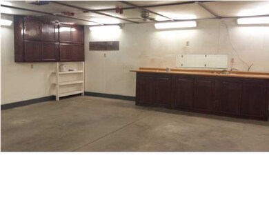 Cabinets and workbench stays with property.