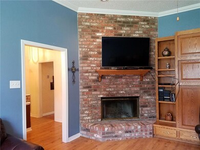 Living room with fireplace and crown molding