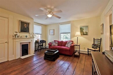 Wide pine floors, original fire...