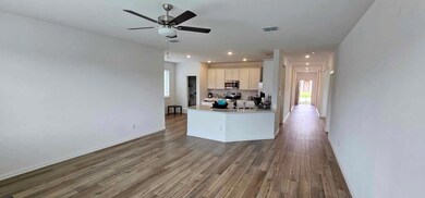 Kitchen with stainless steel appliances, wood fini