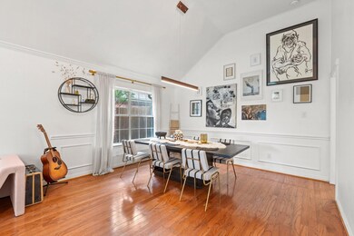 Dining area with crown molding, lofted ceiling, an