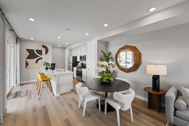 Dining space with recessed lighting and light wood-style flooring