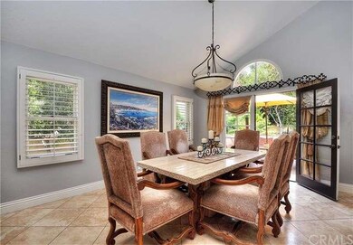 Large formal dining area with a beautiful chandeli