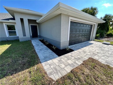 Front view with beautiful finishes and a brick pav