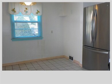 Eat-in-Kitchen with Stainless Refrigerator. Stove 