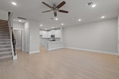 The stairs in this home are neatly tucked away, to not disrupt the privacy and flow of this home
