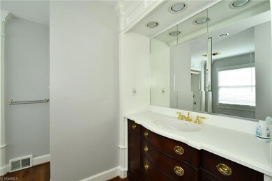 Master bath with hardwoods.