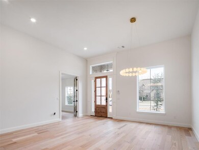 Foyer entrance featuring light hardwood / wood-sty