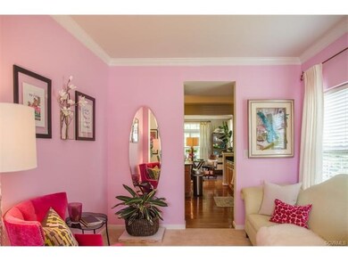 Formal Living Room with crown molding, open and br