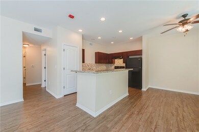 Kitchen with visible vents, a ceiling fan, light w