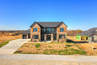 View of front facade featuring a garage