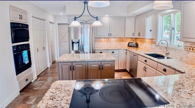Well appointed kitchen features a large pantry.
