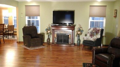 The spacious living room with the hardwood floors 