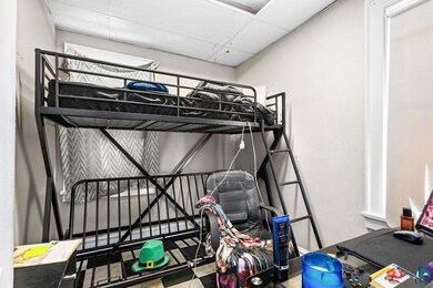 Bedroom featuring a paneled ceiling