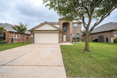 Traditional home featuring a garage, driveway, br