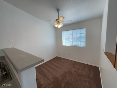Dining area with plenty of natural light and a ceiling fan