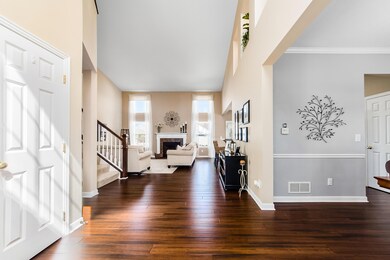 2 Story Foyer w/ Hardwood Flooring