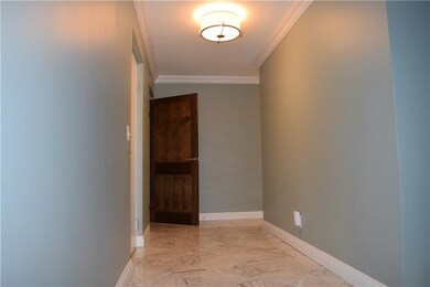 Carrera marble flooring greets you in the entry.