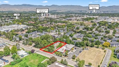 Aerial view of property's location with property parcel outlined and a mountainous background