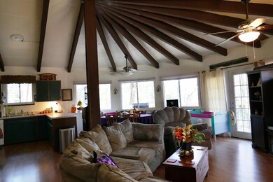 Cool Living Room...Lots of Beams.. and deck access