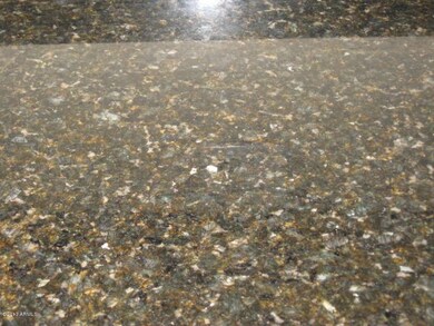 Granite slab in kitchen and baths