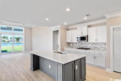 Kitchen featuring large work island