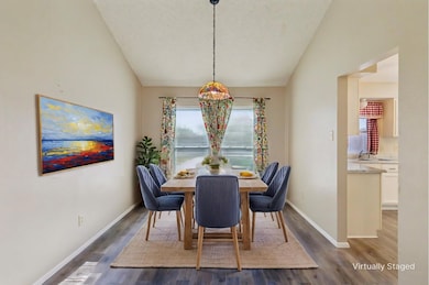 Dining room open to the family room. Door on the r