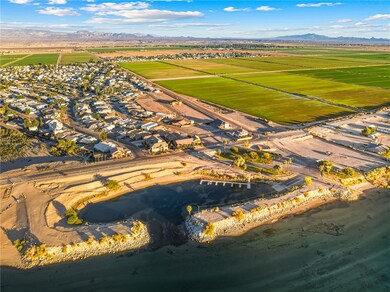 Aerial view of property's location featuring mountains and nearby suburban area