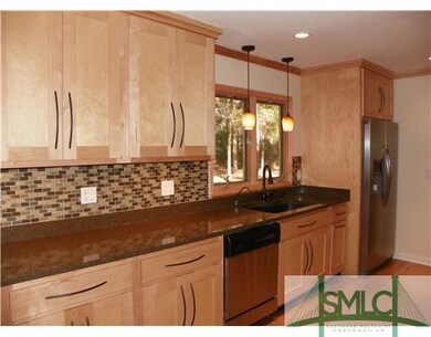 Kitchen. Glass tile back splashes with under cabin