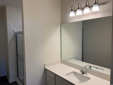 Bathroom with vanity and an enclosed shower