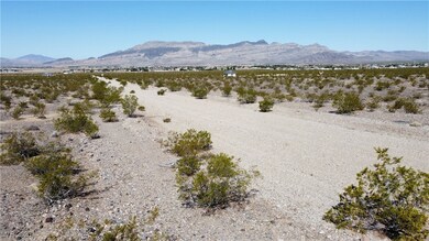 Left view of the dirt road and mountain view from the vacant lot.