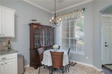 BREAKFAST AREA LOOKING INTO FRONT YARD