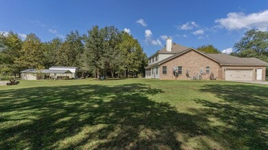 Beautiful Home nestled on almost 4 acres with TONS
