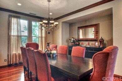 Formal dining room with hardwood flooring