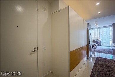 Hallway with expansive windows and recessed lighting