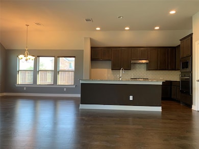 Kitchen featuring appliances with stainless steel