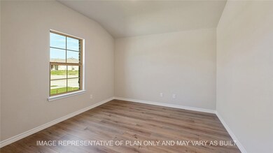 Unfurnished room featuring lofted ceiling, light w