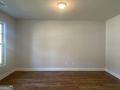 Flex room is ideal for formal dining, at home office, man cave or hobby room