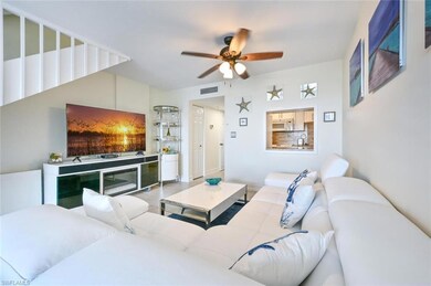 Living area featuring visible vents and a ceiling 