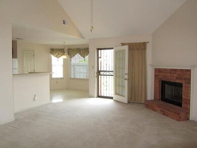 Vaulted great room with wood burning fireplace.