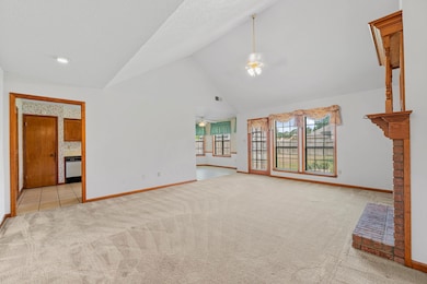 The great room seamlessly connects to the backyard, providing easy access for outdoor entertaining.