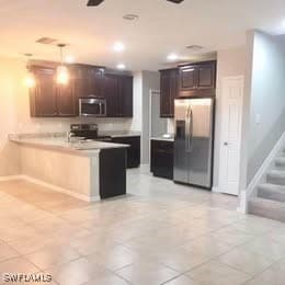 Kitchen with appliances with stainless steel finis