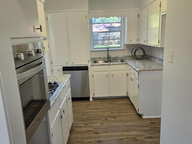 Kitchen features new appliances, vinyl flooring, n