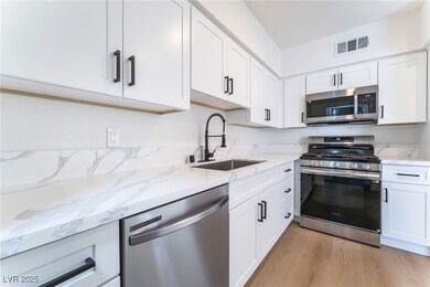 Kitchen with appliances with stainless steel finis