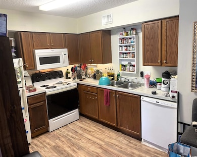 Kitchen featuring light countertops, visible vents